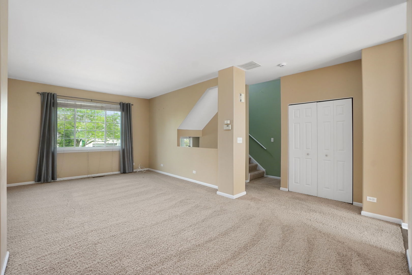 3446 Ravinia Circle Aurora, IL 60504 - Photo 3 of 25 an empty room with windows and closet
