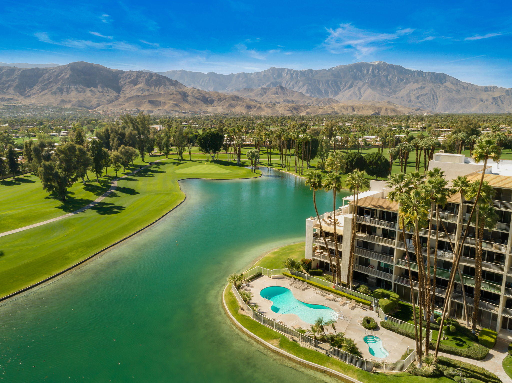 900 Island Drive, Unit 314 Rancho Mirage, CA 92270 - Photo 2 of 46 a view of a lake with a mountain