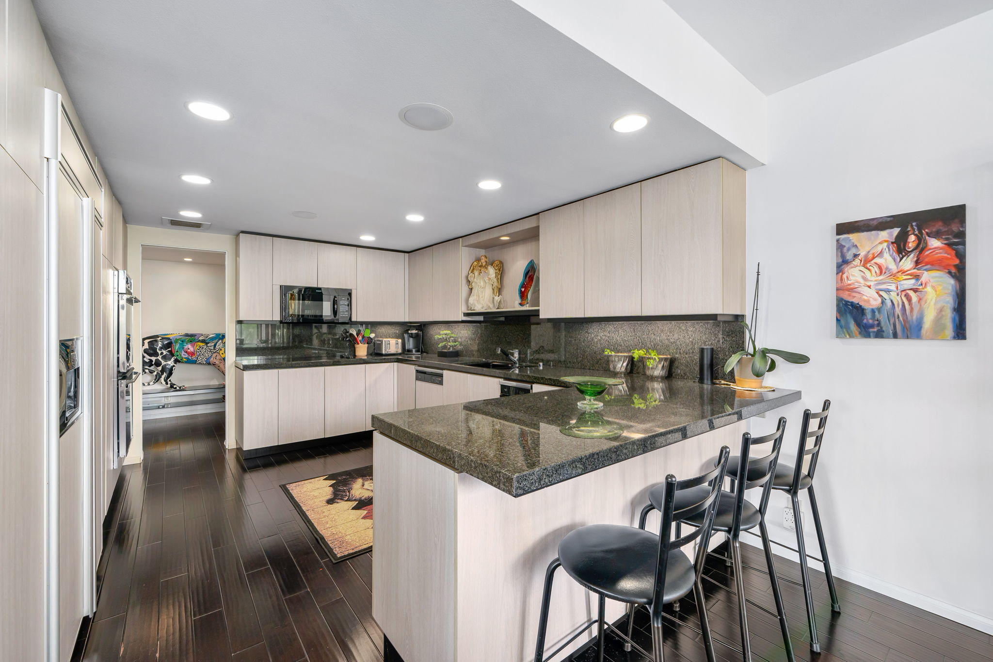 900 Island Drive, Unit 314 Rancho Mirage, CA 92270 - Photo 14 of 46 a kitchen with refrigerator and chairs