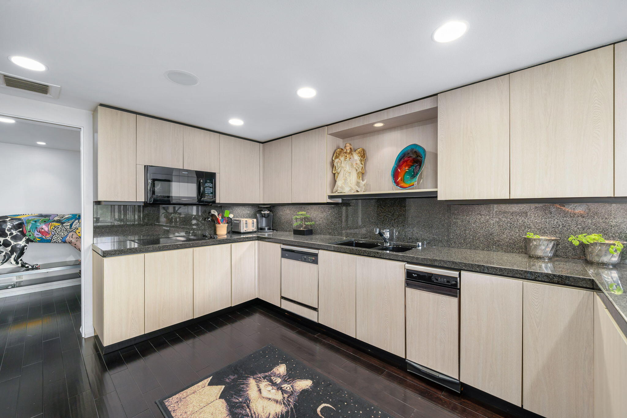 900 Island Drive, Unit 314 Rancho Mirage, CA 92270 - Photo 16 of 46 a kitchen with stainless steel appliances granite countertop a refrigerator and microwave