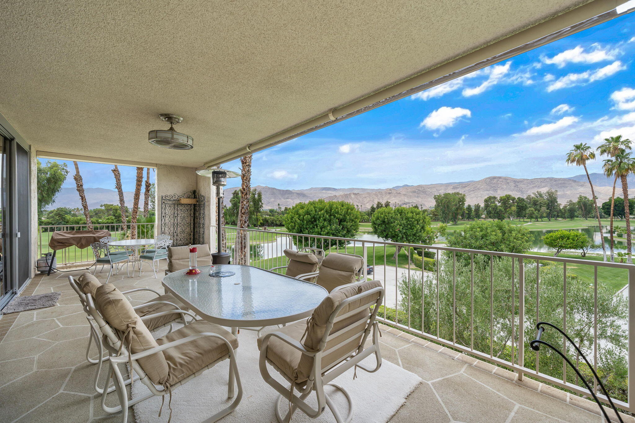 900 Island Drive, Unit 314 Rancho Mirage, CA 92270 - Photo 22 of 46 a view of a chairs and table in patio