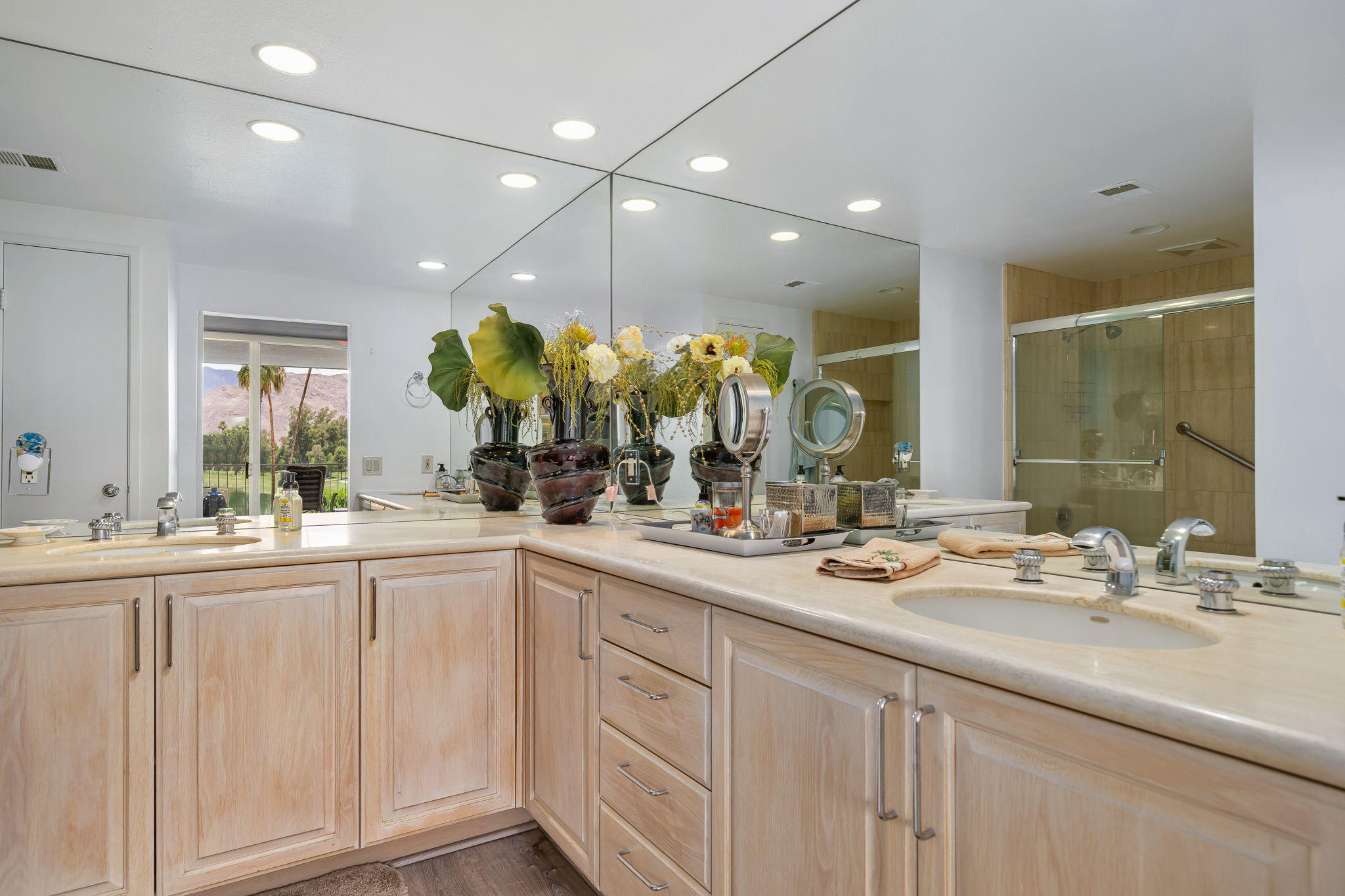 900 Island Drive, Unit 314 Rancho Mirage, CA 92270 - Photo 30 of 46 a bathroom with a sink vanity and mirror