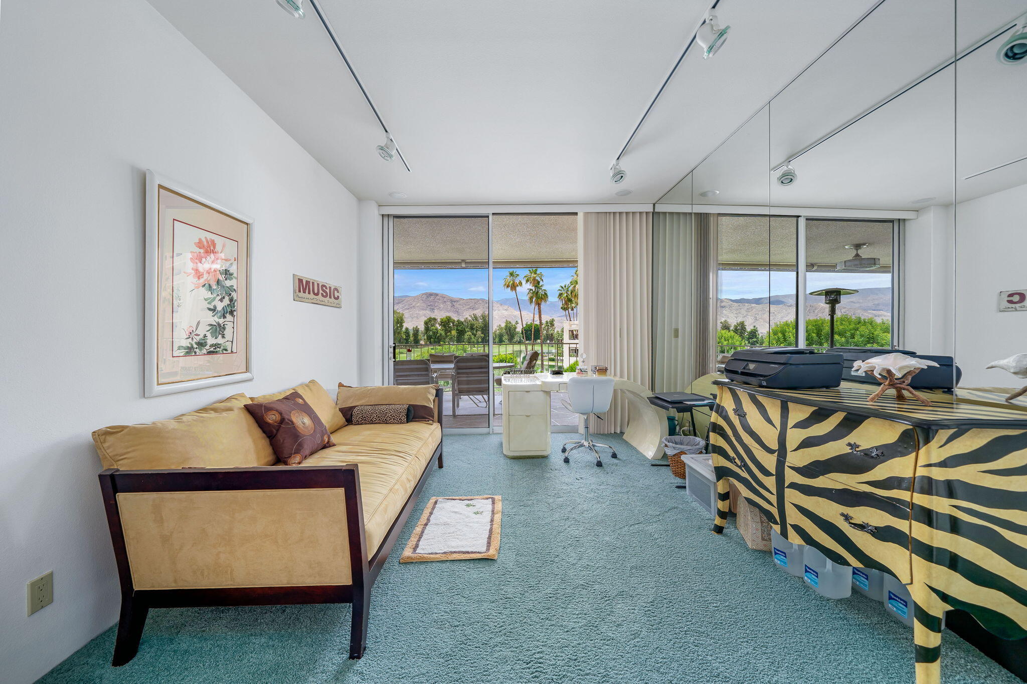 900 Island Drive, Unit 314 Rancho Mirage, CA 92270 - Photo 33 of 46 a living room with furniture and a flat screen tv