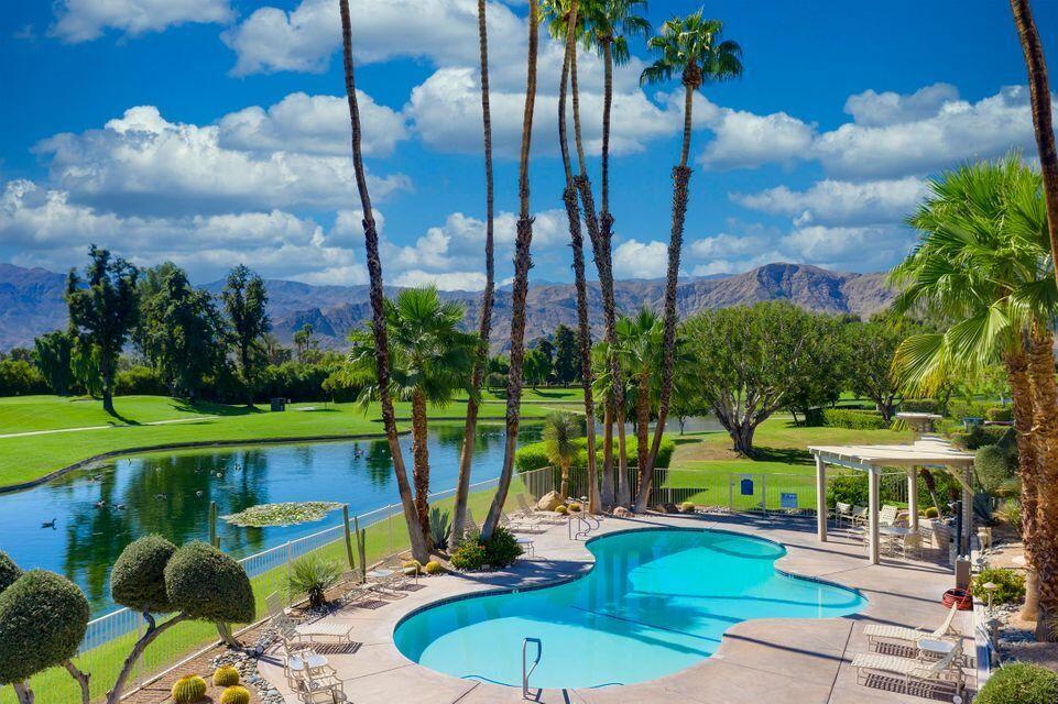 900 Island Drive, Unit 314 Rancho Mirage, CA 92270 - Photo 35 of 46 a view of a chairs and table in patio with a lake view