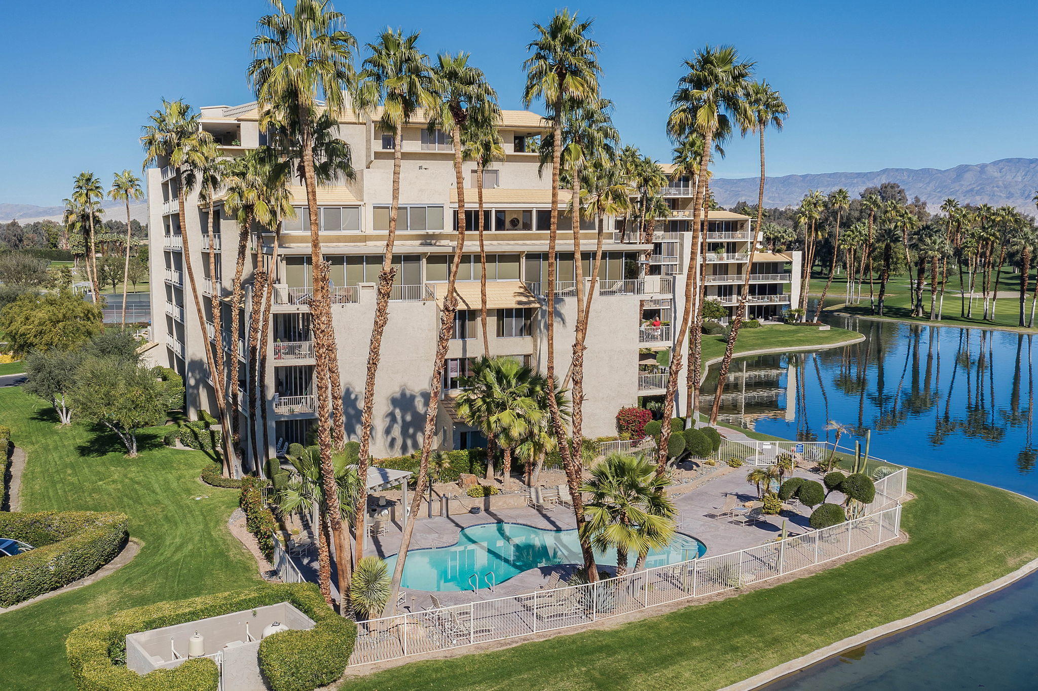 900 Island Drive, Unit 314 Rancho Mirage, CA 92270 - Photo 5 of 46 an aerial view of a house with a garden and plants