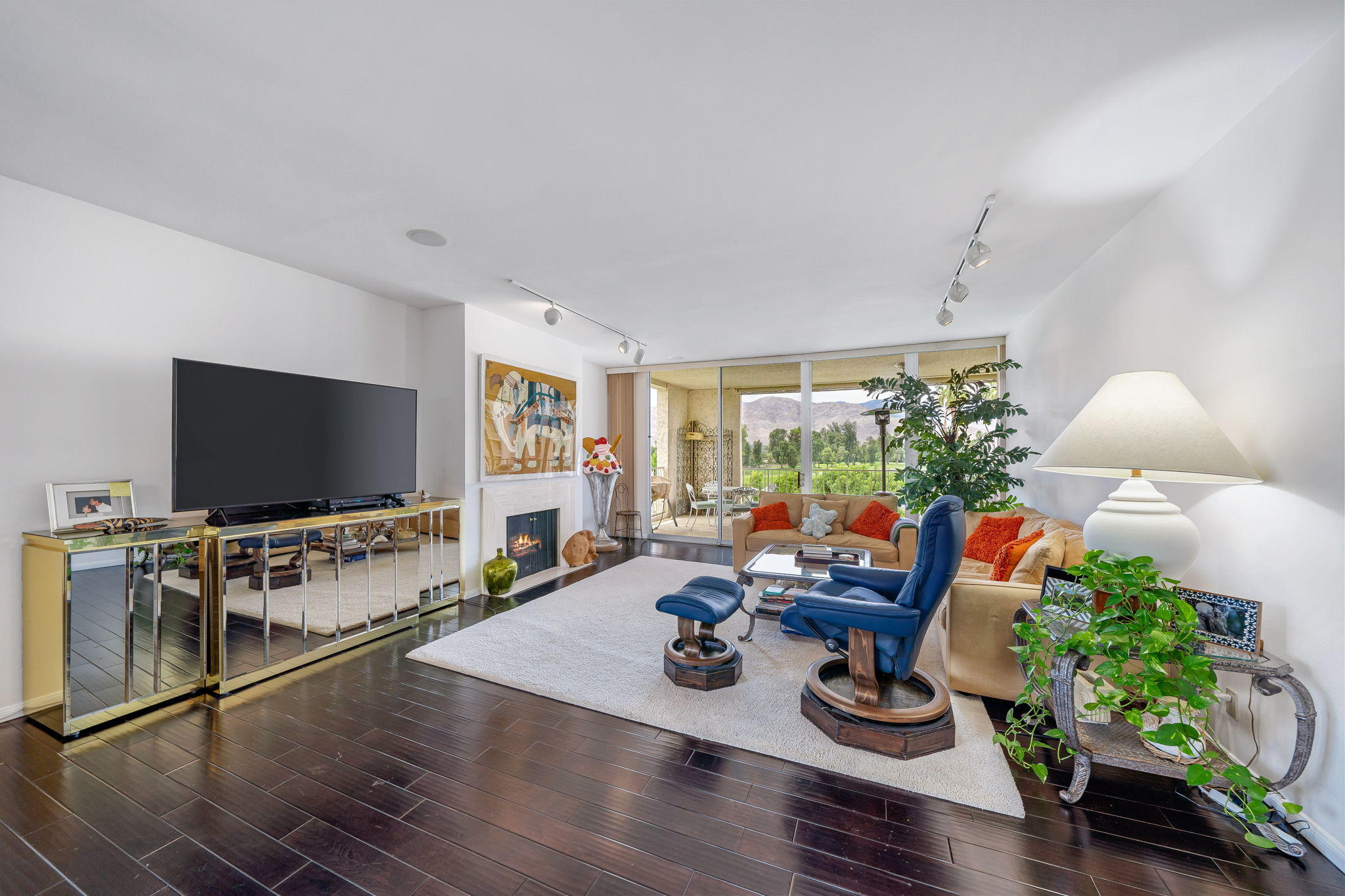 900 Island Drive, Unit 314 Rancho Mirage, CA 92270 - Photo 7 of 46 a living room with furniture and a flat screen tv
