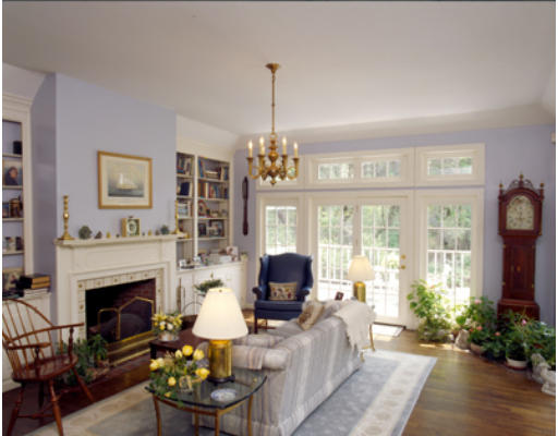 42 Ripley Lane Weston, MA 02493 - Photo 4 of 7 a living room with furniture fireplace and large windows