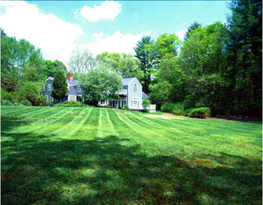 42 Ripley Lane Weston, MA 02493 - Photo 6 of 7 a view of a house with a big yard potted plants and large tree