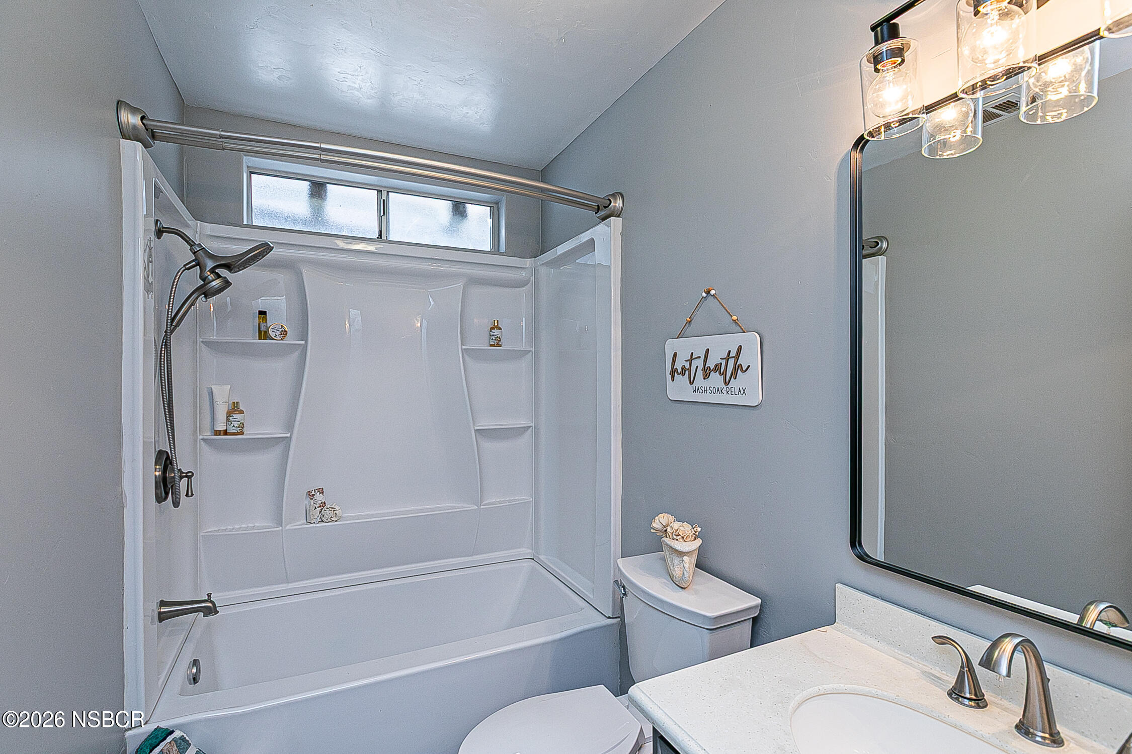 3985 Chatham Way Santa Maria, CA 93455 - Photo 19 of 22 a bathroom with a toilet a sink and bathtub