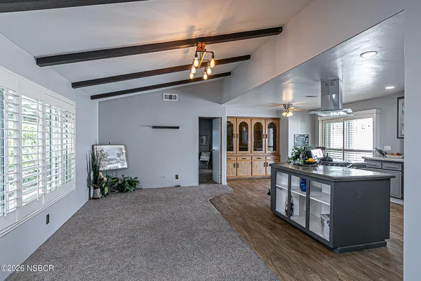 a kitchen with stainless steel appliances granite countertop a stove and a refrigerator