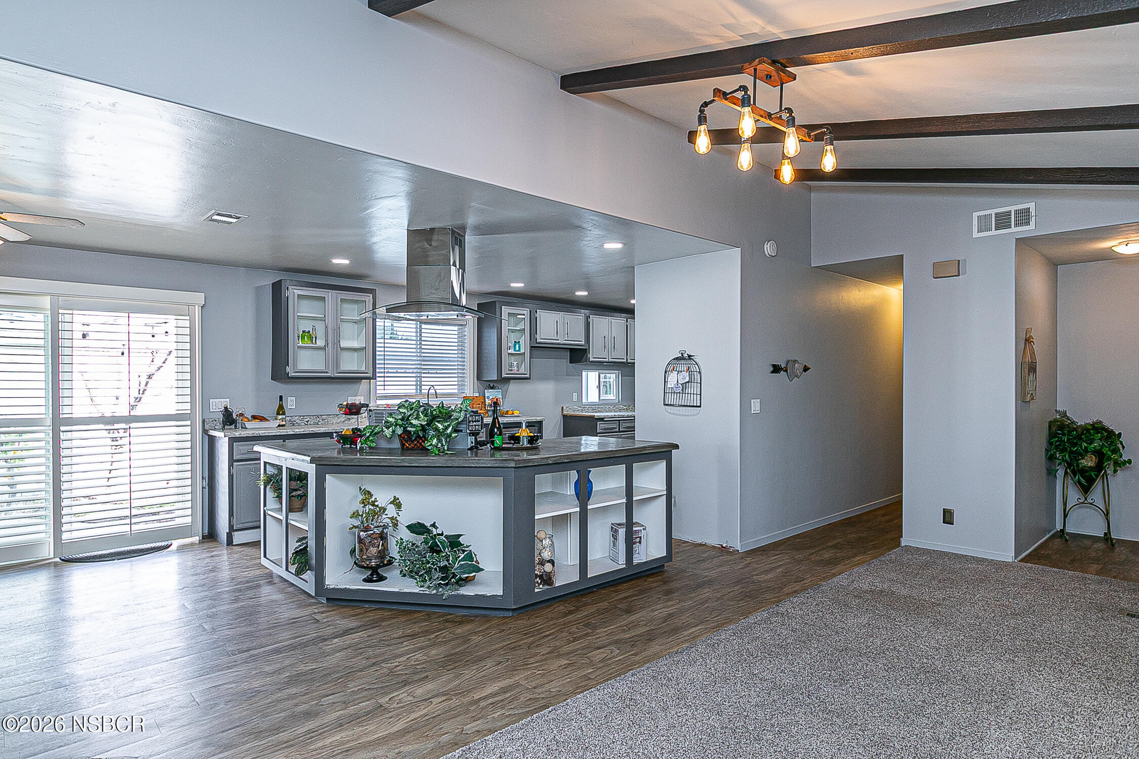 3985 Chatham Way Santa Maria, CA 93455 - Photo 7 of 22 a view of an empty room and kitchen with wooden floor