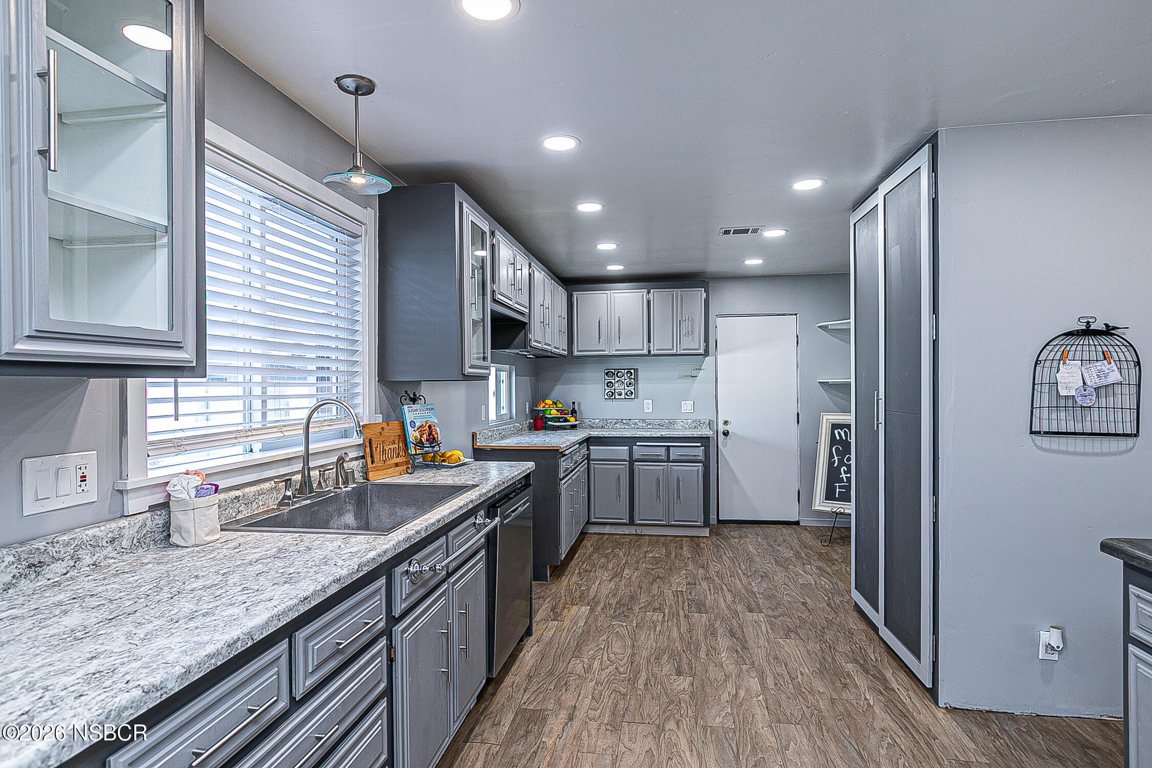3985 Chatham Way Santa Maria, CA 93455 - Photo 10 of 22 a kitchen with stainless steel appliances granite countertop sink stove refrigerator and cabinets