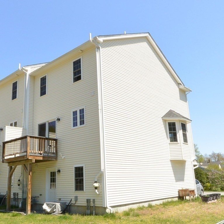 35 Fredonian Street, Unit K Shirley, MA 01464 - Photo 11 of 12 a view of a house with a patio