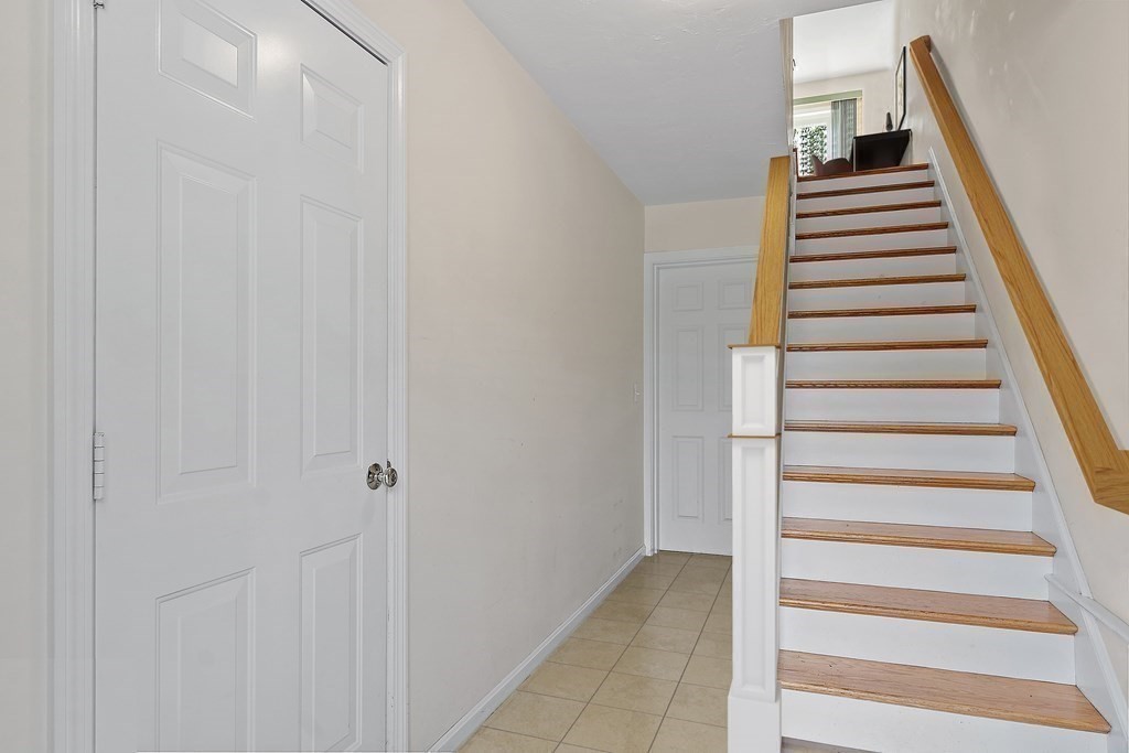 35 Fredonian Street, Unit K Shirley, MA 01464 - Photo 5 of 12 a view of a hallway with staircase