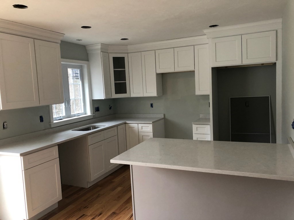 35 Fredonian Street, Unit K Shirley, MA 01464 - Photo 9 of 12 a kitchen with a sink a stove and refrigerator