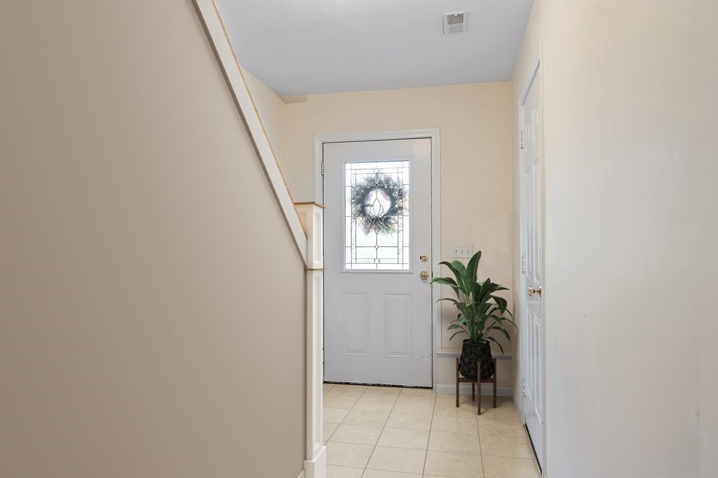 35 Fredonian Street, Unit K Shirley, MA 01464 - Photo 10 of 12 a view of an entryway with wooden floor