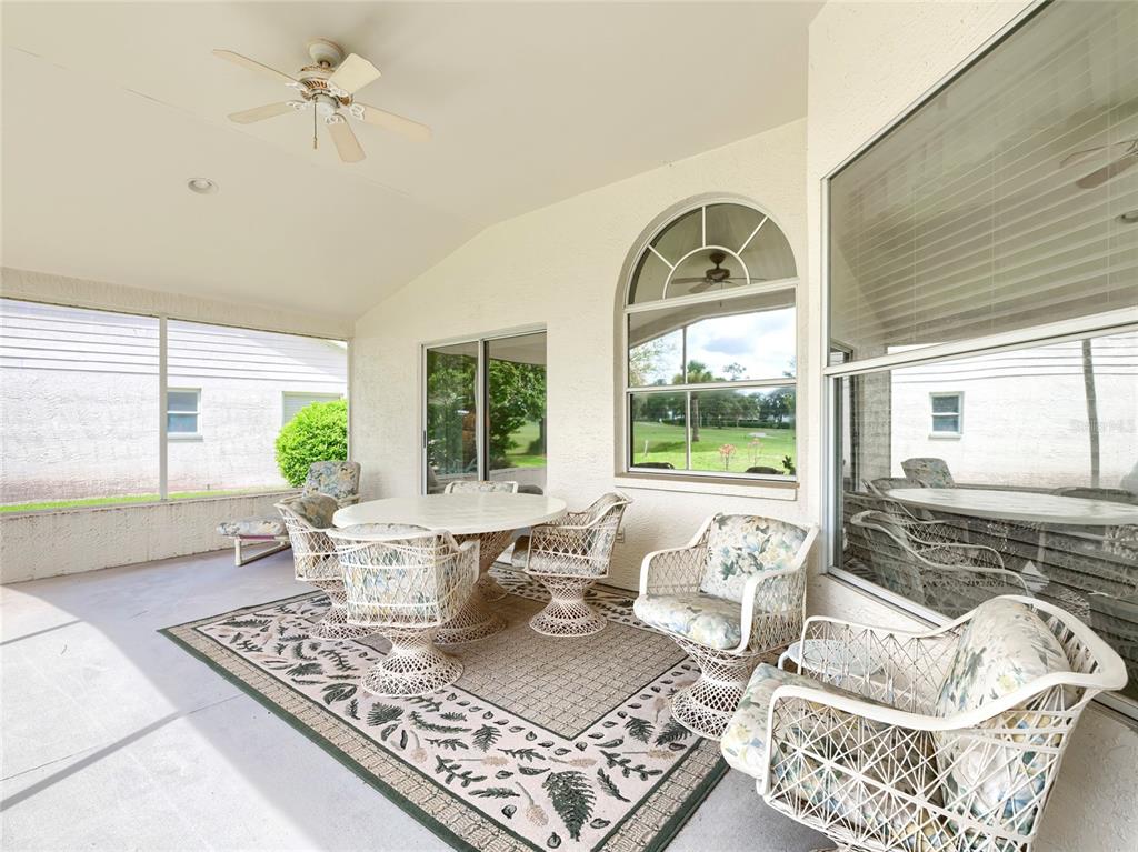 11228 Windrush Circle Hudson, FL 34667 - Photo 12 of 67 a living room with furniture and a large window