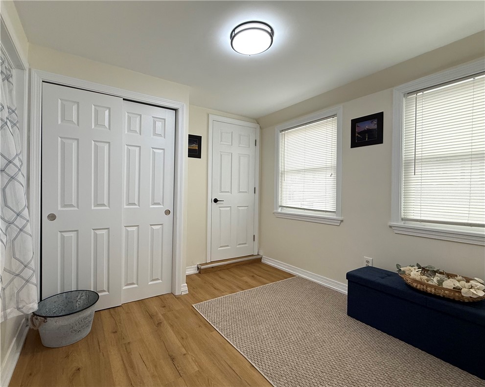 461 River Road Lincoln, RI 02865 - Photo 16 of 30 Mudroom from the garage, and covered patio area has brand new vinyl plank flooring