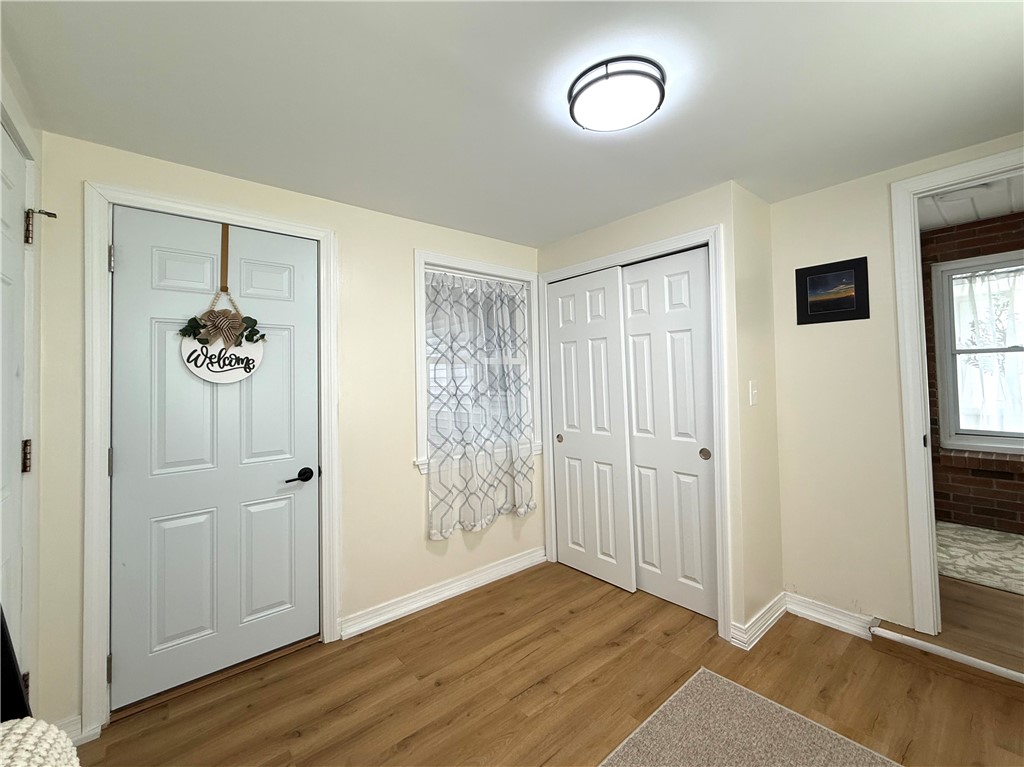 461 River Road Lincoln, RI 02865 - Photo 17 of 30 Mudroom with direct access to covered patio, garage, and main living area with privacy door.