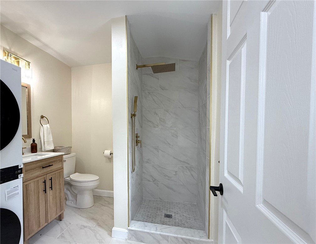 461 River Road Lincoln, RI 02865 - Photo 18 of 30 Full Bathroom with tiled walk-in shower and laundry - on main level