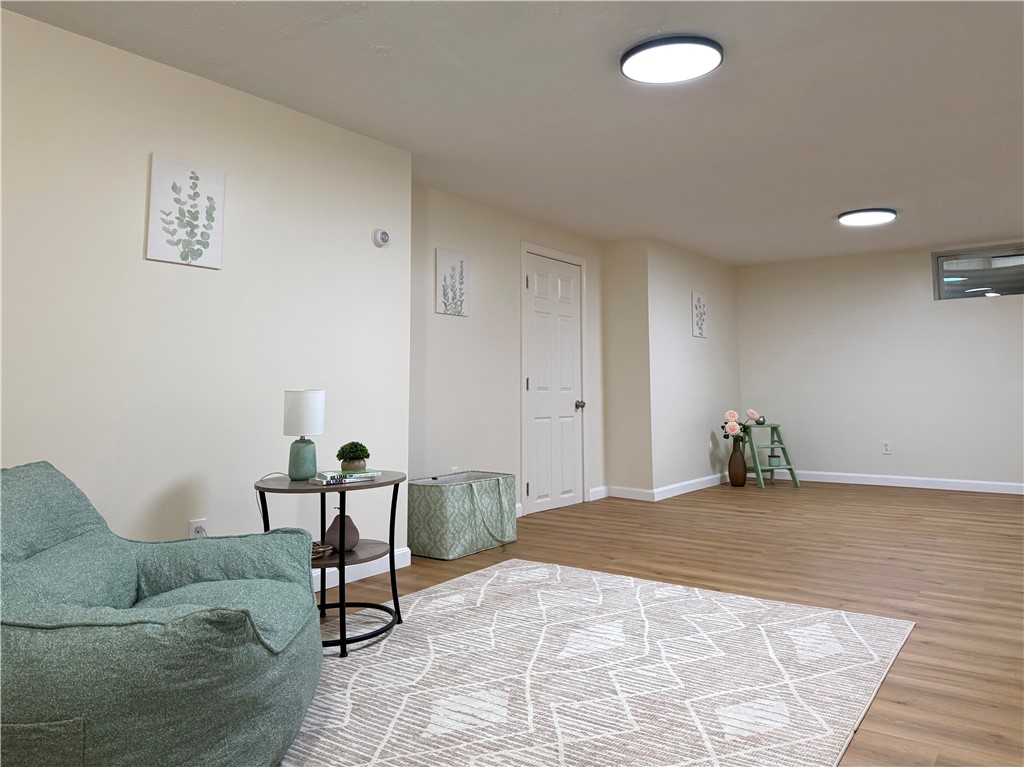 461 River Road Lincoln, RI 02865 - Photo 21 of 30 Finished lower level rec room with new vinyl plank flooring and LED lighting