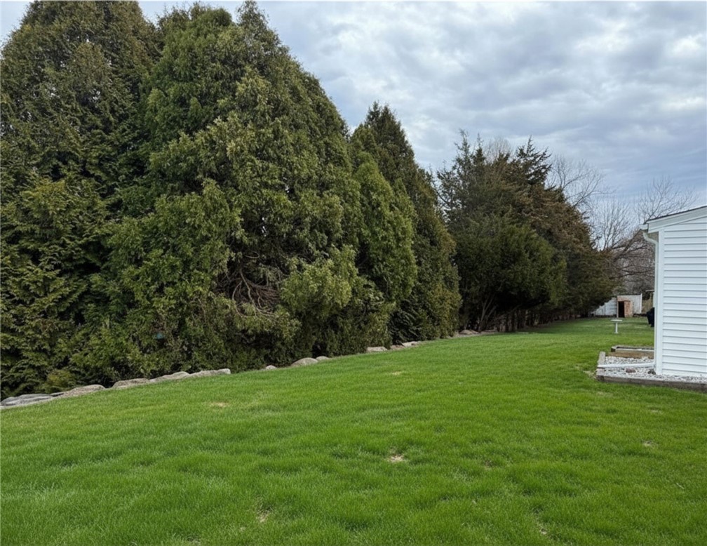 461 River Road Lincoln, RI 02865 - Photo 27 of 30 Grass has been digitally enhanced - yard is mostly flat and is accessible from the back entry