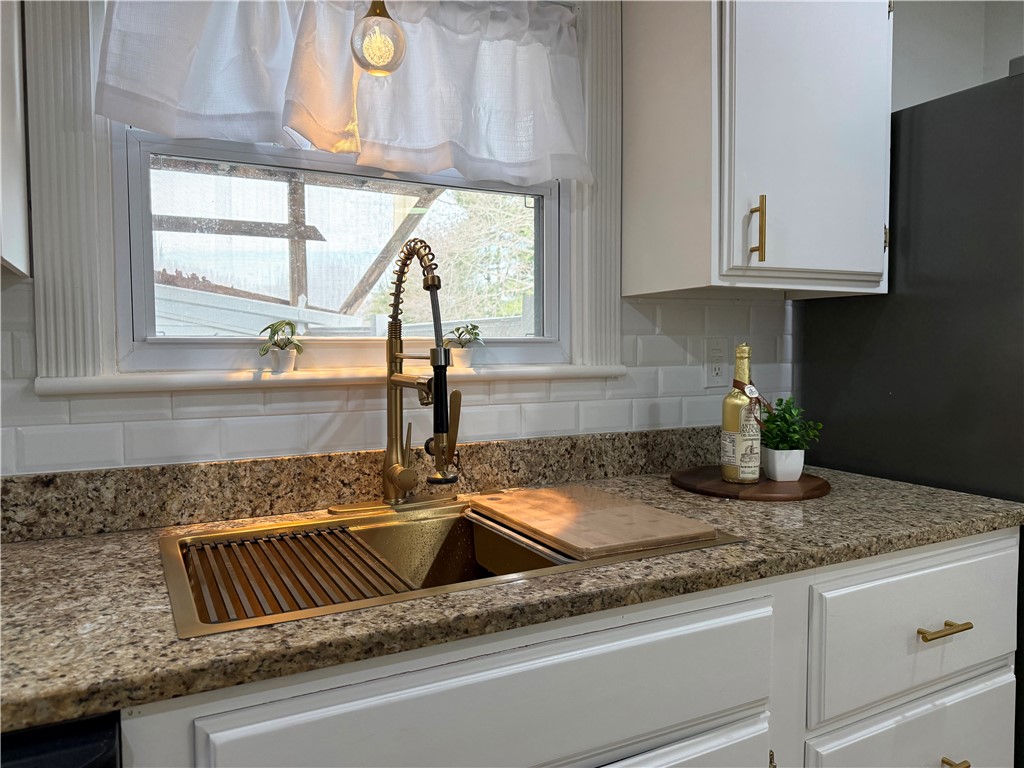 461 River Road Lincoln, RI 02865 - Photo 4 of 30 Gold finishes with unique dandelion pendant lighting