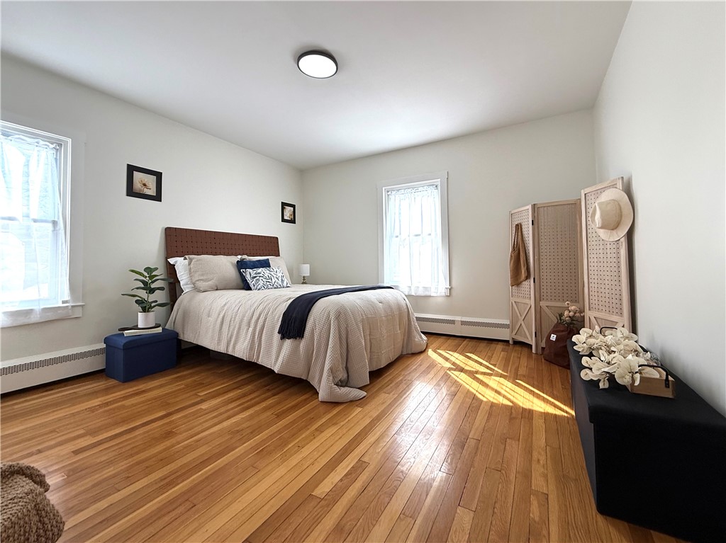 461 River Road Lincoln, RI 02865 - Photo 7 of 30 Large bedroom with hardwoods, closet and plenty of natural light