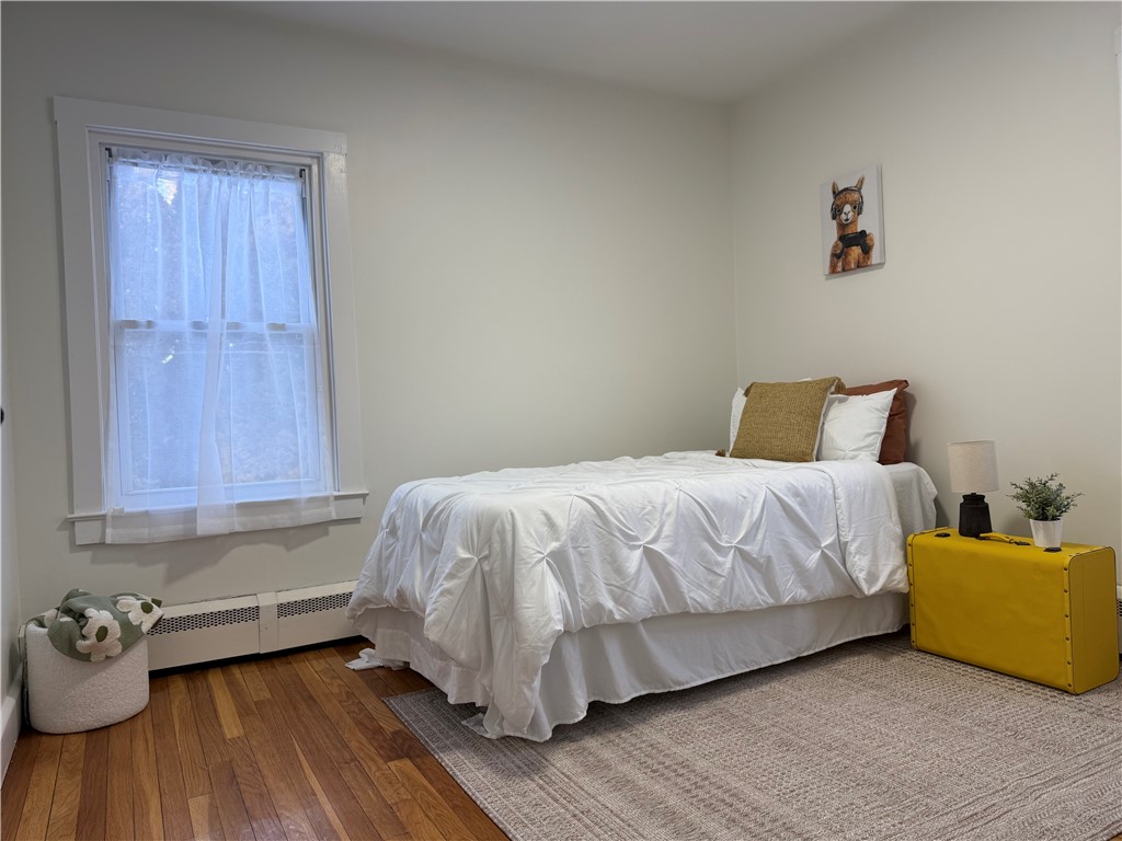 461 River Road Lincoln, RI 02865 - Photo 10 of 30 Secondary bedroom with refinished hardwoods, fresh paint, new led lighting and single closet