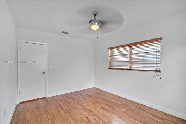 a view of a room that has a window in it