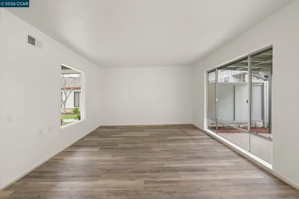 a view of an empty room and window