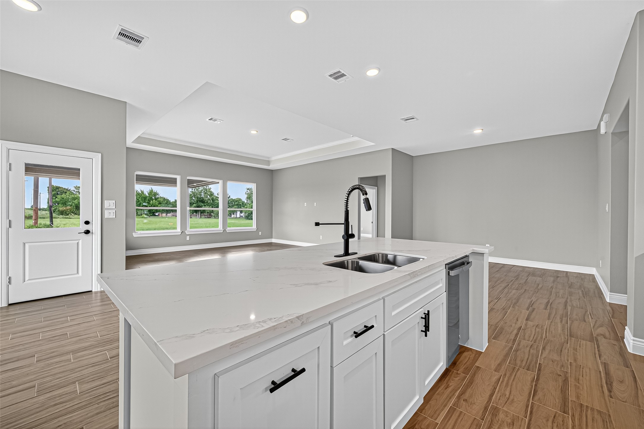 501 Oleander Street Prairie View, TX 77484 - Photo 23 of 48 a kitchen with sink a stove and wooden floor