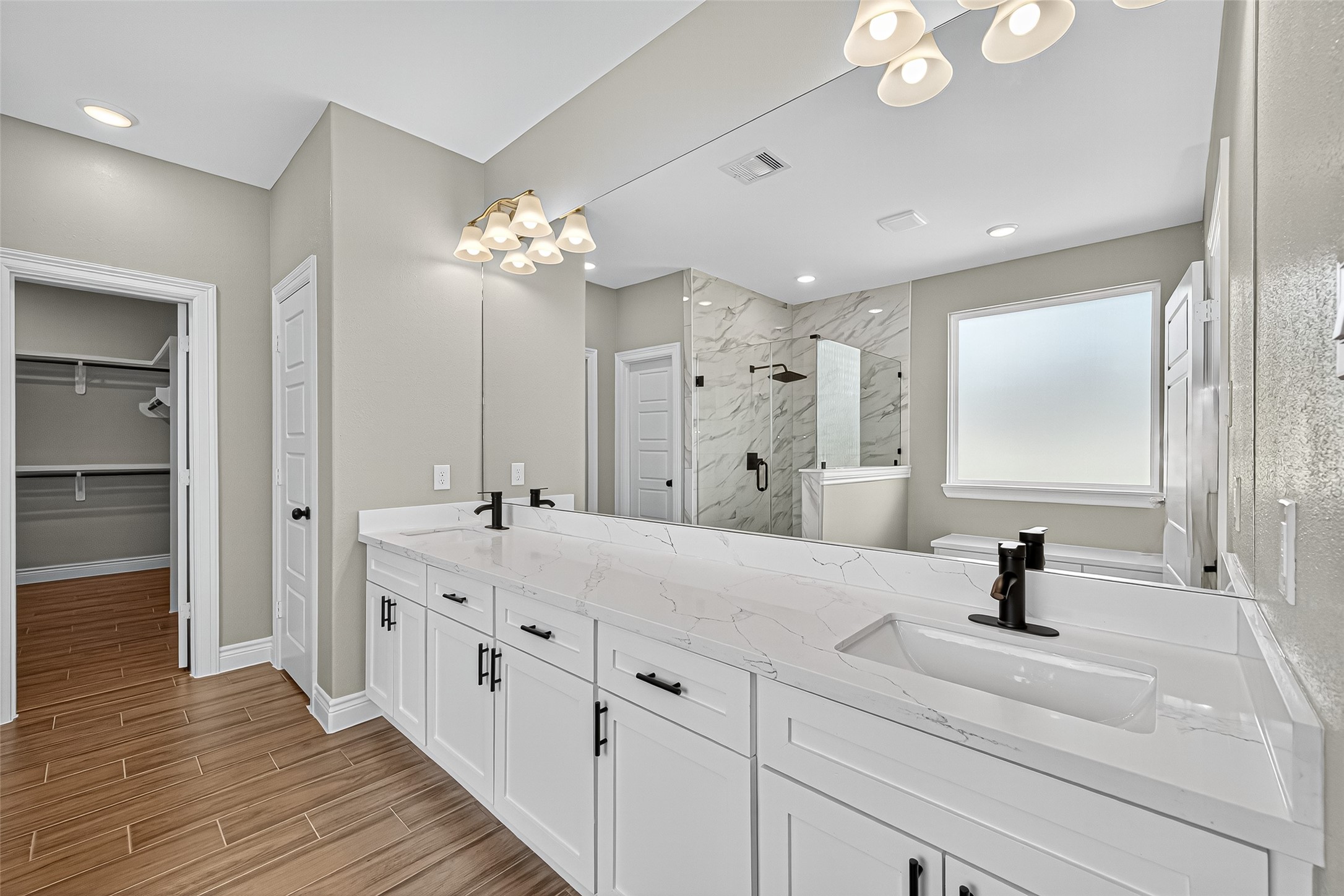 501 Oleander Street Prairie View, TX 77484 - Photo 32 of 48 a bathroom with a double vanity sink and a mirror