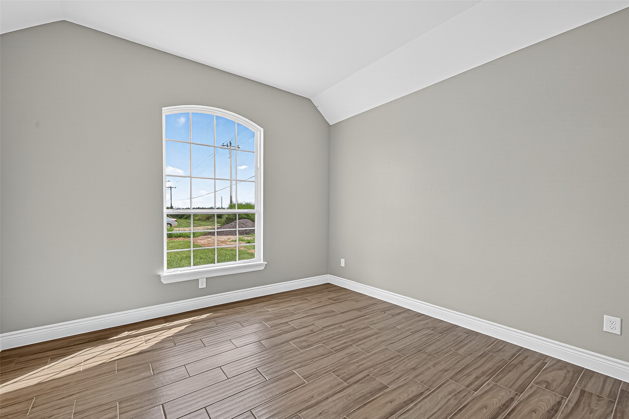 501 Oleander Street Prairie View, TX 77484 - Photo 40 of 48 an empty room with wooden floor and windows