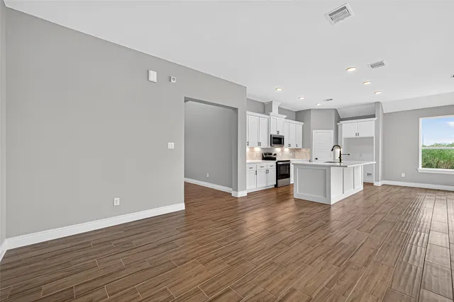a view of kitchen with wooden floor