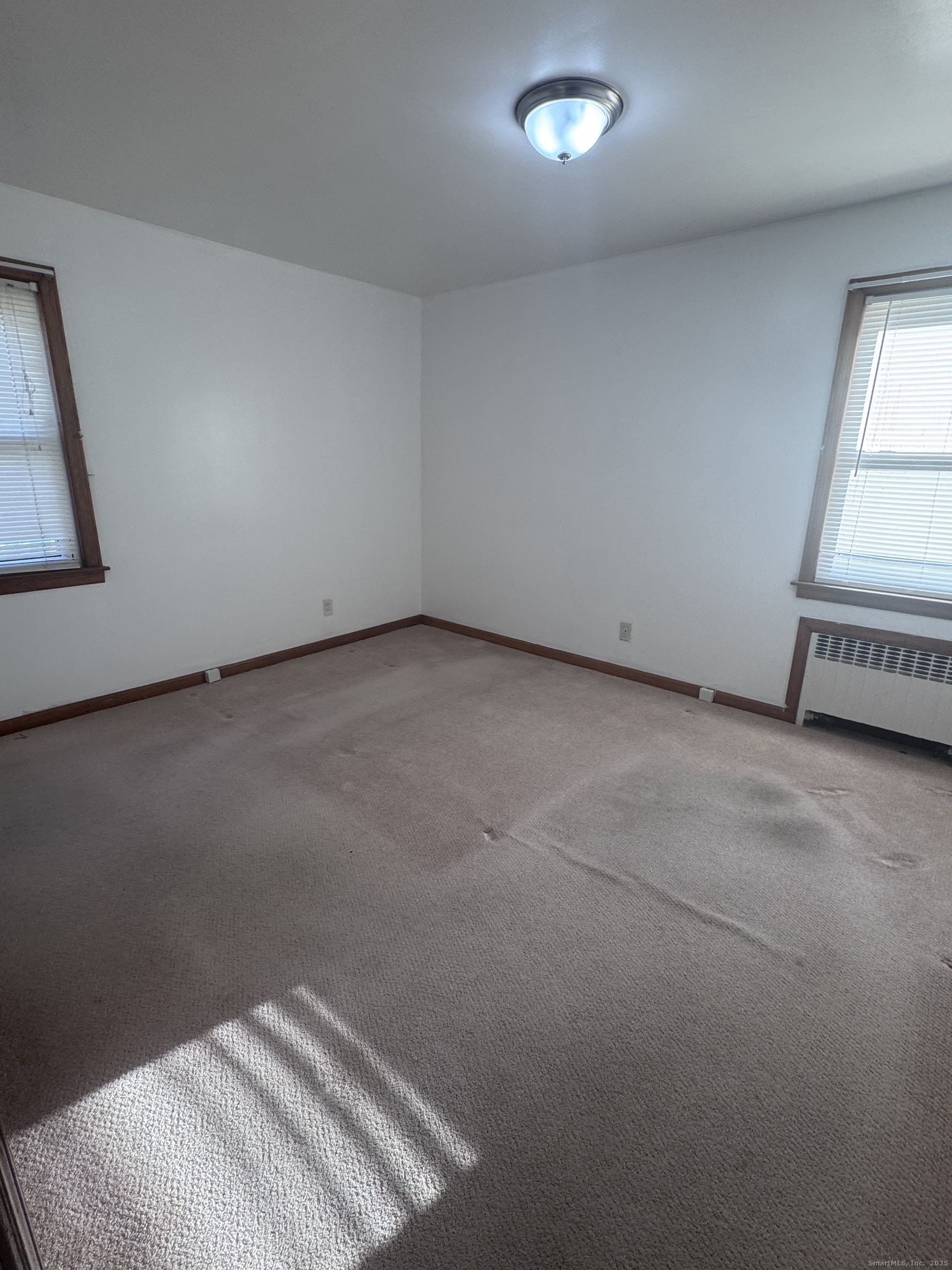 212 Dayton Road Bridgeport, CT 06606 - Photo 11 of 14 an empty room with a window