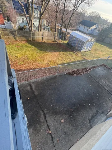 a view of a backyard with wooden floor