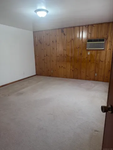 an empty room with closet area