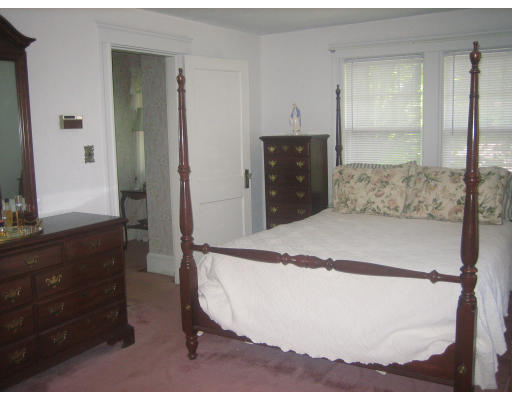 10 Sargent Road Winchester, MA 01890 - Photo 13 of 18 a spacious bedroom with a bed and a dresser