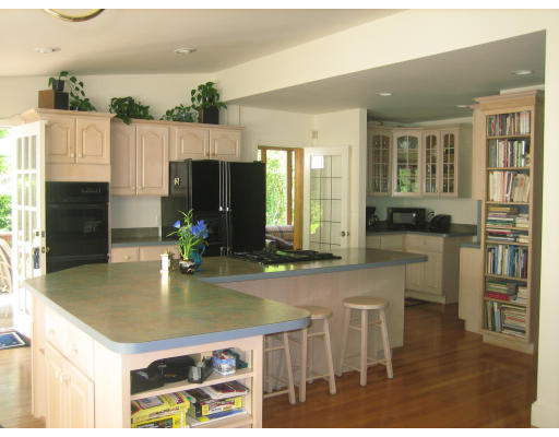 10 Sargent Road Winchester, MA 01890 - Photo 16 of 18 a kitchen with kitchen island a counter top space appliances and cabinets