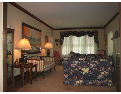 10 Sargent Road Winchester, MA 01890 - Photo 18 of 18 a living room with furniture a lamp and a window