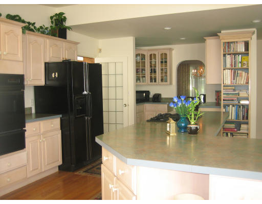 10 Sargent Road Winchester, MA 01890 - Photo 6 of 18 a kitchen with a refrigerator and countertop