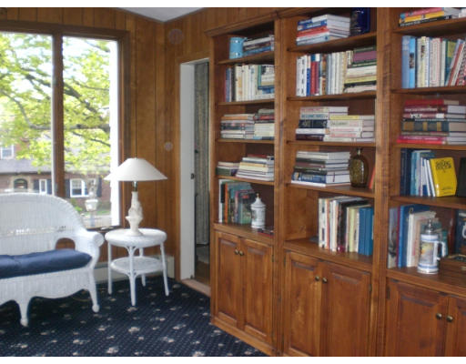 10 Sargent Road Winchester, MA 01890 - Photo 9 of 18 a living room with furniture a bookshelf and a window