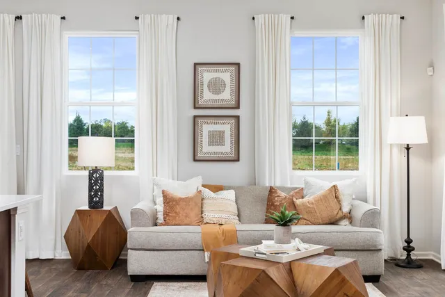 a living room with furniture and a window