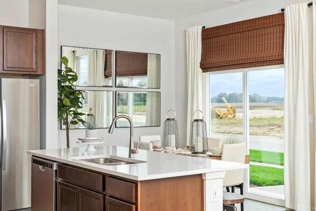 a kitchen with a sink and a window