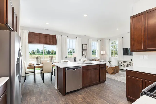 a kitchen with lots of counter top space and dining table