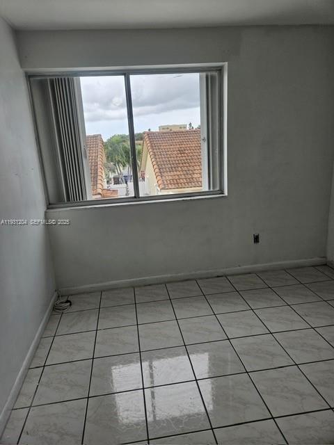 7211 West 24th Avenue, Unit 2304 Hialeah, FL 33016 - Photo 15 of 35 a view of an empty room with a window