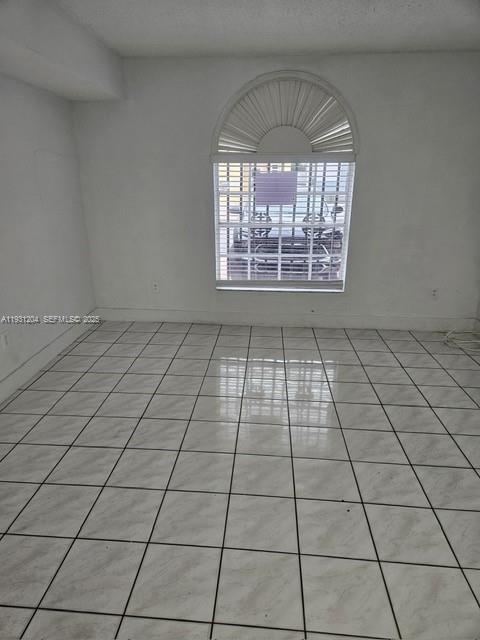 7211 West 24th Avenue, Unit 2304 Hialeah, FL 33016 - Photo 19 of 35 a view of empty room with windows