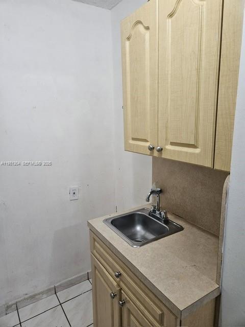 7211 West 24th Avenue, Unit 2304 Hialeah, FL 33016 - Photo 24 of 35 a bathroom with a sink and a mirror