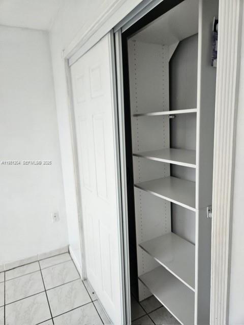 7211 West 24th Avenue, Unit 2304 Hialeah, FL 33016 - Photo 30 of 35 a view of a room with rack on the wall